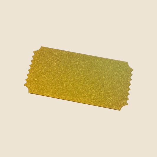Gold glittery acrylic ticket on a white background