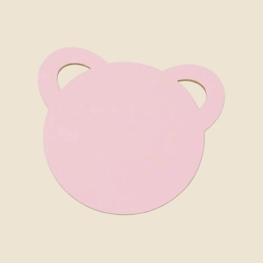 Pink bear-shaped object on a white background